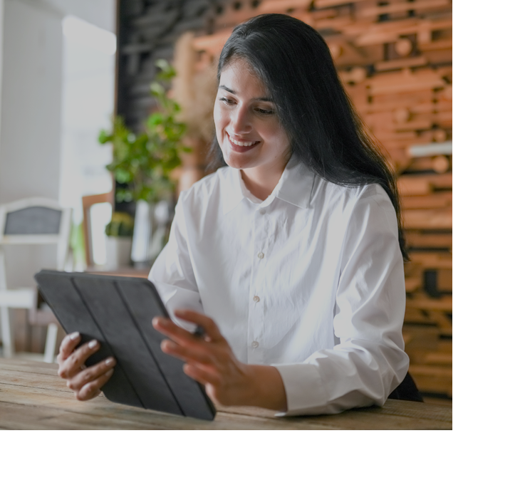 woman holding a black ipad with brown background