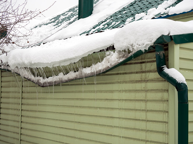 Gutters with Ice Damns - Residential Gutter Replacement